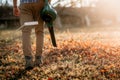 Gardening details, working man using leaf blower in garden Royalty Free Stock Photo