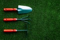 Gardening equipment concept on green grass background top view copy space Royalty Free Stock Photo