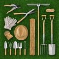 Gardening equipment. Garden vintage set tools with wooden handle grip. Top view isolated on lawn green grass background. Tools for Royalty Free Stock Photo