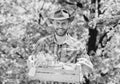 Gardening expert tips. Garden care. Mature farmer man planting plants. Planting season. Bearded gardener guy hold box Royalty Free Stock Photo