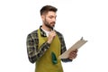 Male gardener with clipboard and pen thinking