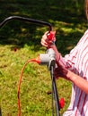 Woman being mowing lawn with lawnmower Royalty Free Stock Photo