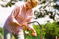 Woman being mowing lawn with lawnmower Royalty Free Stock Photo