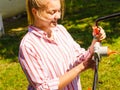 Woman being mowing lawn with lawnmower Royalty Free Stock Photo