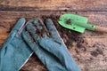 Gardening gloves and shovel in soil Royalty Free Stock Photo