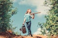 Gardening guide for beginners. Gardening tips. Spring gardening. Girl child hold shovel watering can. Spring gardening Royalty Free Stock Photo