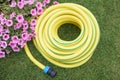 Gardening- hose-pipe on the grass Royalty Free Stock Photo