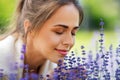 Close up of woman smelling lavender flowers