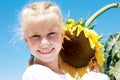 Gardening, planting concept - portrait of lovely girl with sunflower