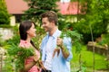 Gardening in summer - couple harvesting carrots Royalty Free Stock Photo