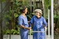 Gardening therapy in dementia treatment on elderly woman at nursing home Royalty Free Stock Photo