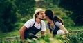 Gardening together is a labor of love. an affectionate young couple working in a garden together. Royalty Free Stock Photo