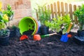 Gardening tools colorful pot on soil background ready to planting flowers and small plant in the garden works concept Royalty Free Stock Photo