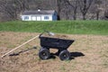 Gardening tools on dirt and grasses in yard cart