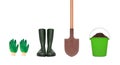 Gardening tools - gloves, rubber boots, shovel and plastic bucket with soil isolated on white Royalty Free Stock Photo