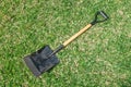 Gardening tools on grass green background