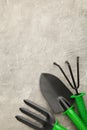 Gardening tools on grey concrete background, top view Royalty Free Stock Photo