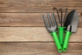 Gardening tools on grey wooden background, top view Royalty Free Stock Photo