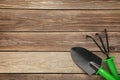Gardening tools on grey wooden background, top view Royalty Free Stock Photo