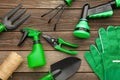Gardening tools on grey wooden background, top view Royalty Free Stock Photo
