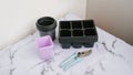 Gardening tools with plastic seedling trays and pruning shears on marble surface Royalty Free Stock Photo
