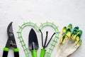 Gardening tools on white background, flat lay, copy space, top view. Concept of hobby, springtime, garden maintenance, landscaping