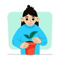 Gardening. Woman plants a sprout in a pot.