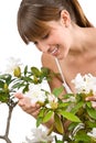 Gardening - woman with Rhododendron flower Royalty Free Stock Photo