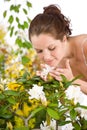 Gardening - Woman smelling blossom flower Royalty Free Stock Photo