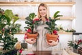 Gardening. Young caucasian florist woman working at garden Royalty Free Stock Photo