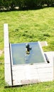 Gardens with sculpture of child swimming in Collblanc