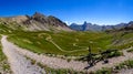 Gardetta - Mountain bike on scenic trail with view of Rocca La Meja in Maira valley in the Cottian Alps, Piedmont Royalty Free Stock Photo