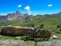 Gardetta - Mountain bike on scenic trail with view of Rocca La Meja in Maira valley in the Cottian Alps, Piedmont Royalty Free Stock Photo