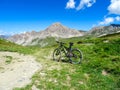 Gardetta - Mountain bike on scenic trail with view of Rocca La Meja in Maira valley in the Cottian Alps, Piedmont Royalty Free Stock Photo