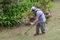 Gardner mowing the grass Royalty Free Stock Photo