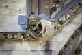 Gargoyle carved on one of the external walls of Westminster Abbey founded by Benedictine monks in