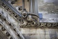 Gargoyle carved on one of the external walls of Westminster Abbey founded by Benedictine monks in
