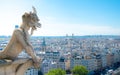Gargoyle chimera on Notre Dame de Paris close up overlooking blur city at a summer day Royalty Free Stock Photo