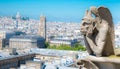Gargoyle chimera on Notre Dame de Paris close up overlooking blur city at a summer day Royalty Free Stock Photo