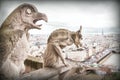 Gargoyle (chimera), stone demons, with Paris city on background.