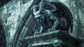 Gargoyle on Gothic cathedral roof, old monster statue close-up. Vintage stone demon sculpture on building wall background. Concept Royalty Free Stock Photo