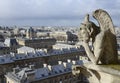 Gargoyle on the roof of Notre-Dame overlooking Paris Royalty Free Stock Photo
