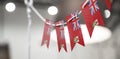 A garland of Bermuda national flags on an abstract blurred background