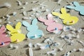Garland with colorful paper rabbits on concrete background. Concept Easter Bunny Banner. Top view