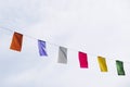 Garland with colorful pennants hanging on a city street