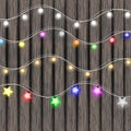 Garland lights set on Marry Christmas and happy new year on wood background