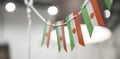 A garland of Niger national flags on an abstract blurred background