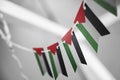 A garland of Palestine national flags on an abstract blurred background