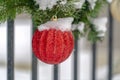 Garland with red glittered christmas ball ornament