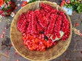 Garland of rose petals in bamboo basket at a market in Bangalore